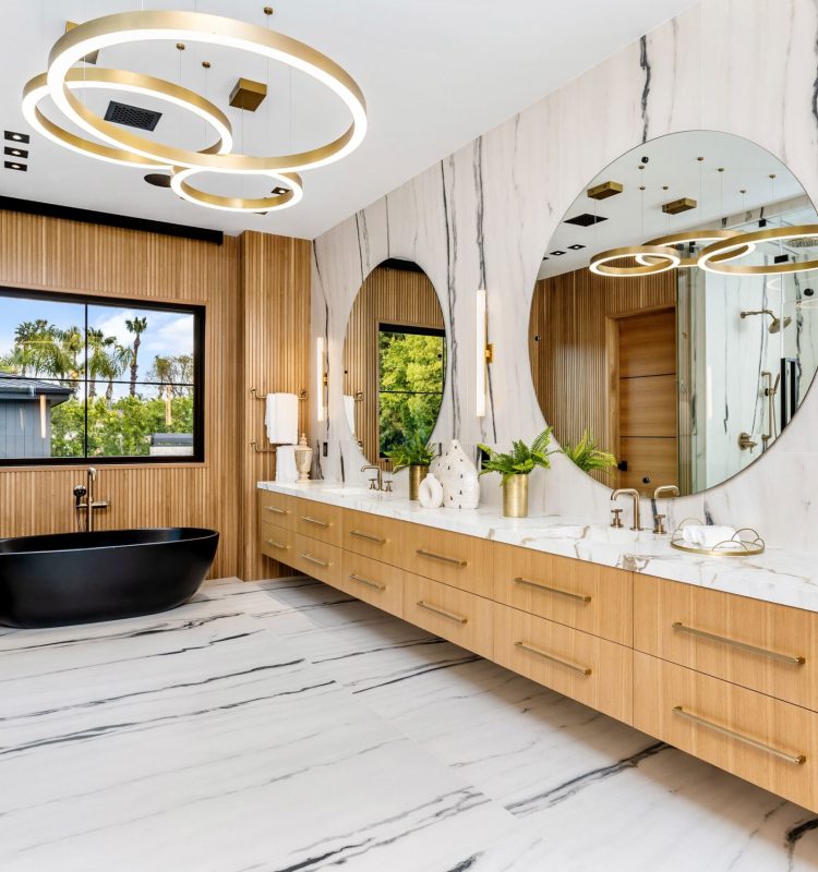 A luxury modern bathroom featuring a black bathtub and elegant marble flooring.