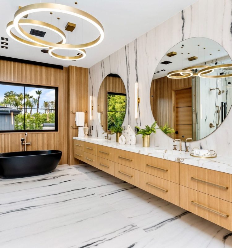 A luxury modern bathroom featuring a black bathtub and elegant marble flooring.